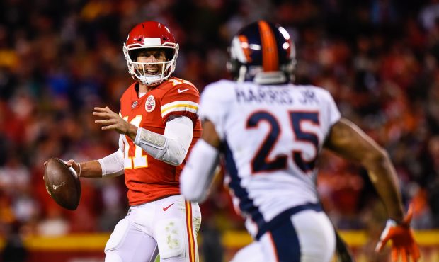 KANSAS CITY, MO - OCTOBER 30: Quarterback Alex Smith #11 of the Kansas City Chiefs is pressured out...