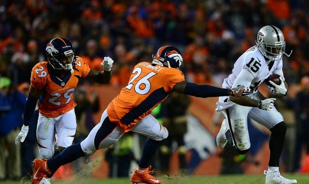 DENVER, CO - JANUARY 1:  Free safety Darian Stewart #26 of the Denver Broncos tackles wide receiver...