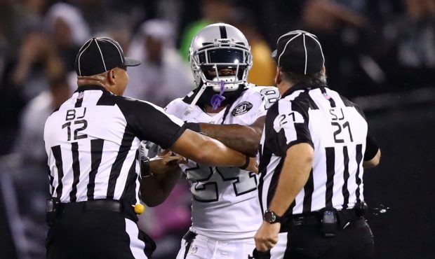 OAKLAND, CA - OCTOBER 19:  Marshawn Lynch #24 of the Oakland Raiders is restrained after coming off...