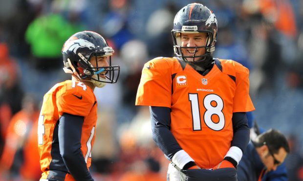 DENVER, CO - JANUARY 12:  (L-R) Brandon Stokley #14 and Peyton Manning #18 of the Denver Broncos wa...