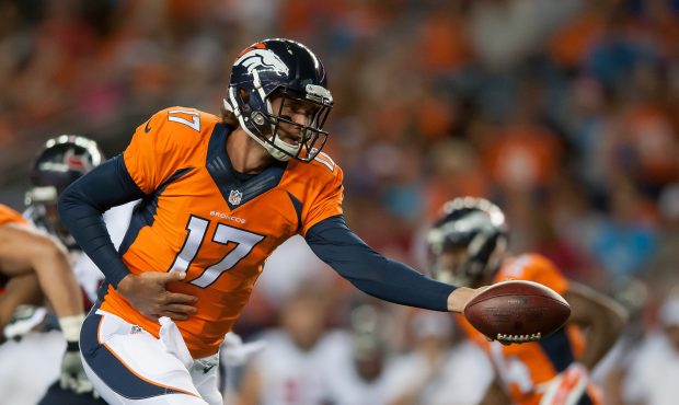 DENVER, CO - AUGUST 23:  Quarterback Brock Osweiler #17 of the Denver Broncos hands off the ball ag...