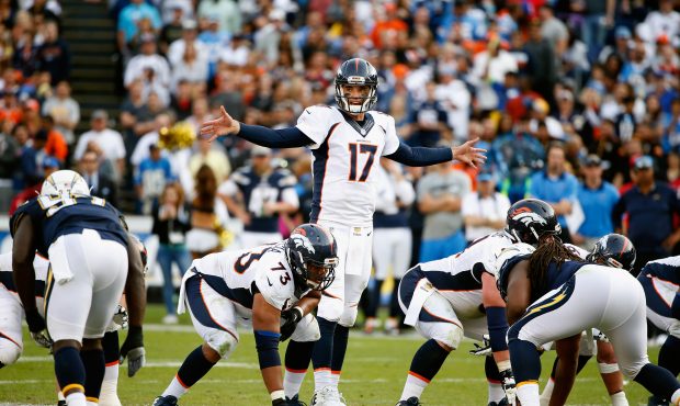 SAN DIEGO, CA - DECEMBER 06:  Brock Osweiler #17 of the Denver Broncos calls plays at the line of s...