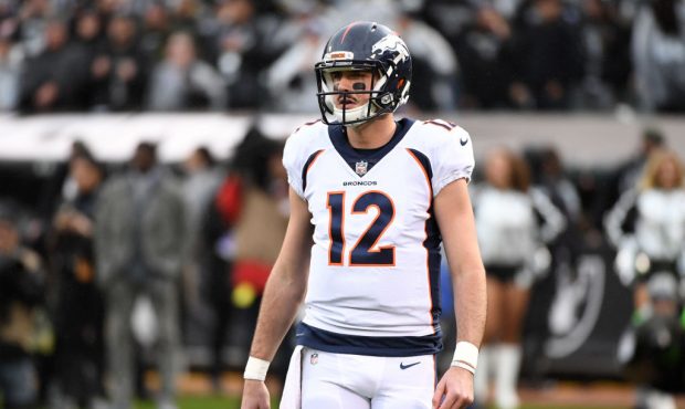 OAKLAND, CA - NOVEMBER 26:  Paxton Lynch #12 of the Denver Broncos looks on during their NFL game a...