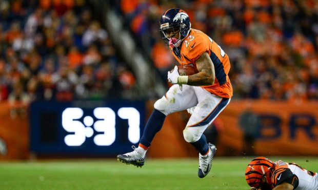 DENVER, CO - NOVEMBER 19:  Running back Devontae Booker #23 of the Denver Broncos rushes against th...