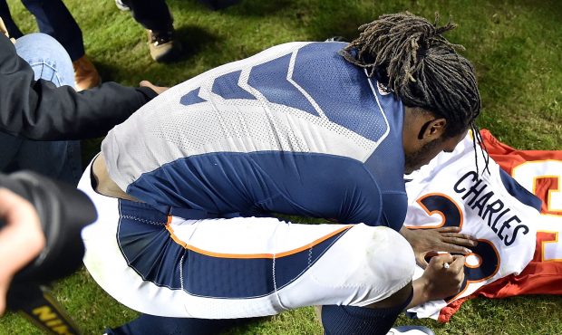 KANSAS CITY, MO - OCTOBER 30:  Running back Jamaal Charles #28 of the Denver Broncos signs a jersey...