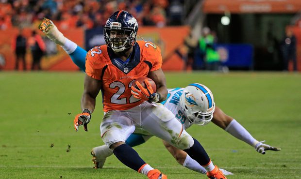 DENVER, CO - NOVEMBER 23:  Running back C.J. Anderson #22 of the Denver Broncos carries the ball an...