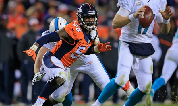 Outside linebacker Von Miller #58 of the Denver Broncos battles the block of tackle Jason Fox #74 o...