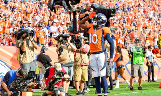 DENVER, CO - SEPTEMBER 17:  Wide receiver Emmanuel Sanders #10 of the Denver Broncos celebrates wit...
