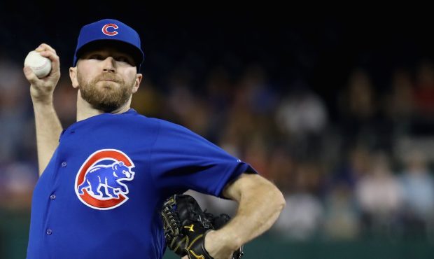Wade Davis #71 of the Chicago Cubs throws to a Washington Nationals batter in the ninth inning at N...