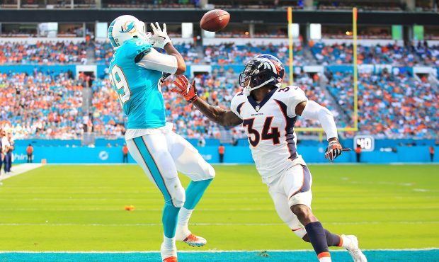 Julius Thomas #89 of the Miami Dolphins makes the catch for a touchdown in the second quarter again...