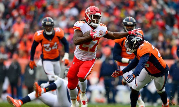 Running back Kareem Hunt #27 of the Kansas City Chiefs breaks away for a first quarter touchdown ru...
