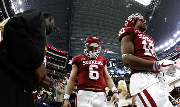 ARLINGTON, TX - DECEMBER 2: Baker Mayfield #6 of the Oklahoma Sooners takes the field with teammate...