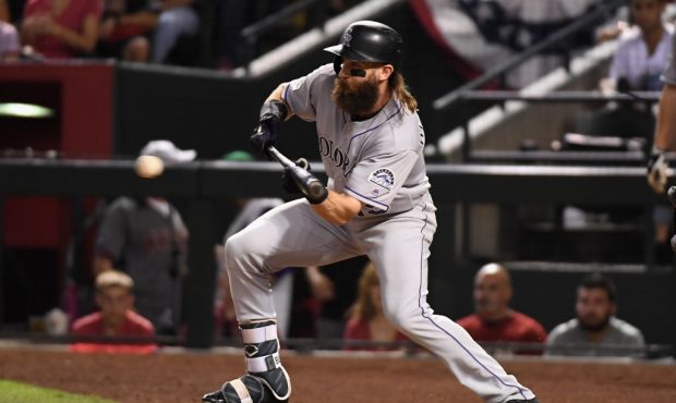 PHOENIX, AZ - OCTOBER 04: Charlie Blackmon #19 of the Colorado Rockies bunts during the top of the ...