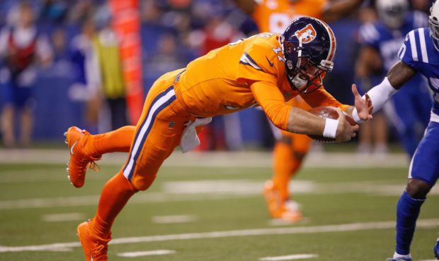 INDIANAPOLIS, IN - DECEMBER 14:  Brock Osweiler #17 of the Denver Broncos dives into the end zone f...
