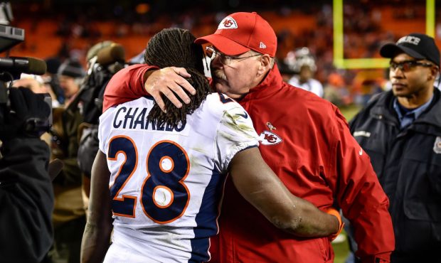 KANSAS CITY, MO - OCTOBER 30: Head coach Andy Reid of the Kansas City Chiefs hugs his former player...