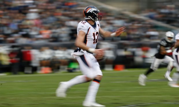 OAKLAND, CA - NOVEMBER 26: Quarterback Paxton Lynch #12 of the Denver Broncos looks to pass the bal...