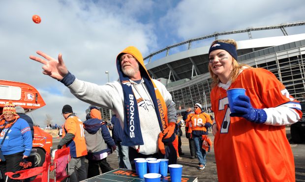 DENVER, CO - JANUARY 12:  Fans of the Denver Broncos play a ping pong drinking game as they tailgat...