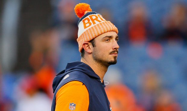 DENVER, CO - OCTOBER 15:  Quarterback Paxton Lynch #12 of the Denver Broncos looks on from the fiel...