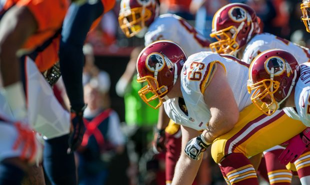DENVER, CO - OCTOBER 27:  Quarterback Robert Griffin III #10 of the Washington Redskins waits for t...