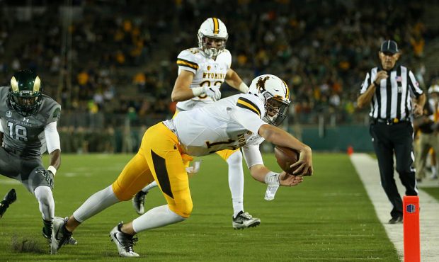FORT COLLINS, CO - OCTOBER 1:  Quarterback Josh Allen #17 of the Wyoming Cowboys dives into the end...