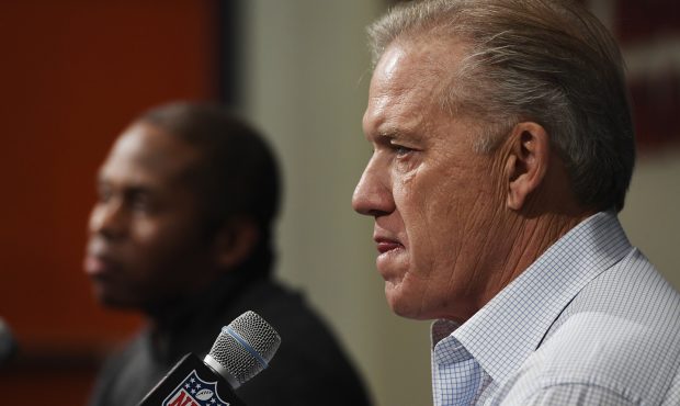 Denver Broncos head coach Vance Joseph and executive vice president of football operations John Elw...