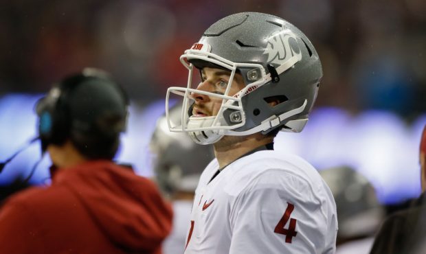 SEATTLE, WA - NOVEMBER 25:  Quarterback Luke Falk #4 of the Washington State Cougars looks on durin...