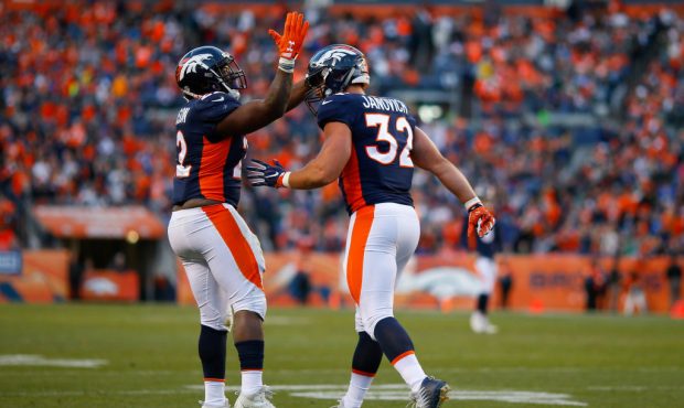 DENVER, CO - DECEMBER 10:  Running back C.J. Anderson #22 of the Denver Broncos congratulates Andy ...