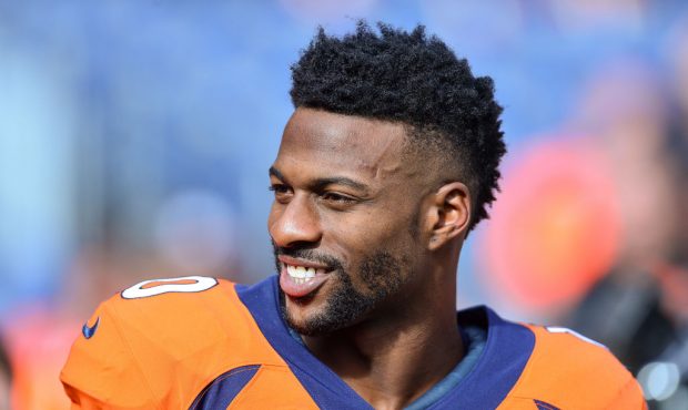 Wide receiver Emmanuel Sanders of the Denver Broncos smiles during player warm ups before a game ag...