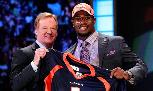 Von Miller, #2 overall pick by the Denver Broncos holds up a jersey on stage during the 2011 NFL Dr...