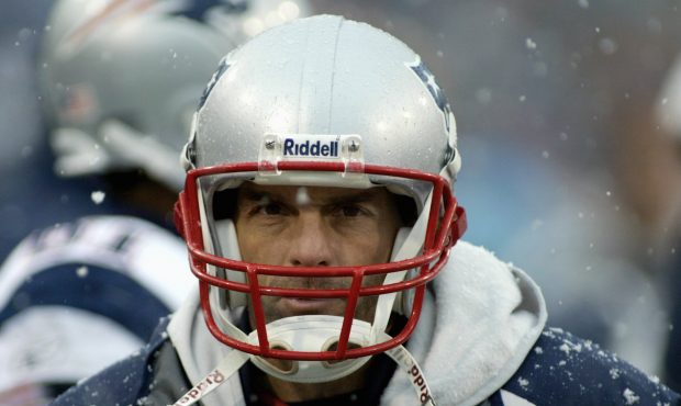 ORCHARD PARK, NY - DECEMBER 11:  Doug Flutie #2 of the New England Patriots rests on the sideline d...