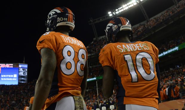 Denver Broncos wide receiver Demaryius Thomas (88) and wide receiver Emmanuel Sanders (10) watch ov...