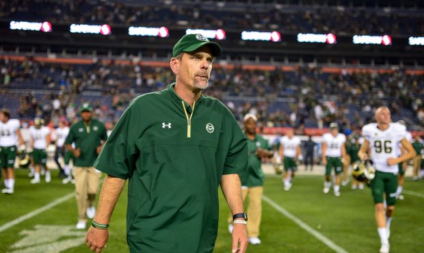 DENVER, CO - SEPTEMBER 1:  Head coach Mike Bobo of the Colorado State Rams walks onto the field aft...
