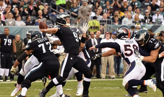 Philadelphia Eagles quarterback Nick Foles #9 launches a long pass for a first down late in the gam...