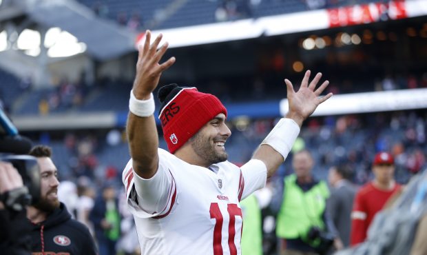 Quarterback Jimmy Garoppolo #10 of the San Francisco 49ers reacts after the 49ers defeated the Chic...