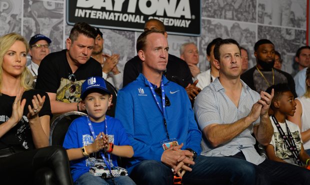 Two-time Super Bowl winning quarterback Peyton Manning, his son, Marshall, and friend Brandon Stokl...