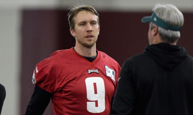 MINNEAPOLIS, MN - FEBRUARY 02: Nick Foles #9 of the Philadelphia Eagles speaks with head coach Doug...