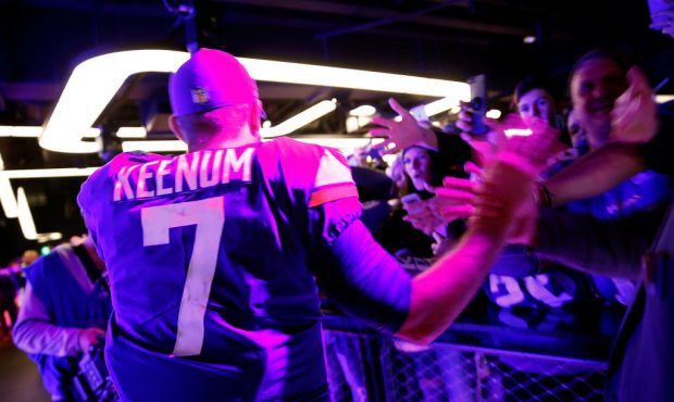 MINNEAPOLIS, MN - JANUARY 14:  Quarterback Case Keenum #7 of the Minnesota Vikings is congratulated...