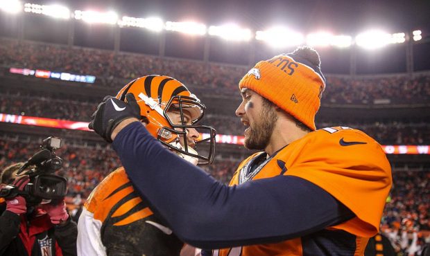 DENVER, CO - DECEMBER 28:  Quarterback Brock Osweiler #17 of the Denver Broncos and quarterback AJ ...