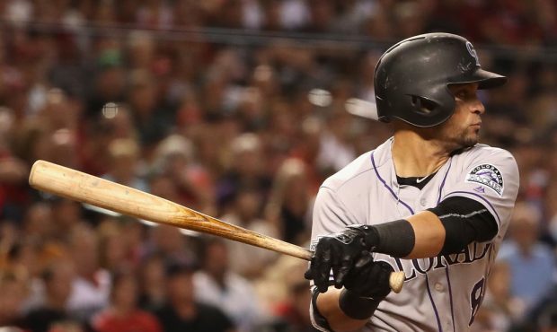 Gerardo Parra #8 of the Colorado Rockies hits a single against the Arizona Diamondbacks during the ...