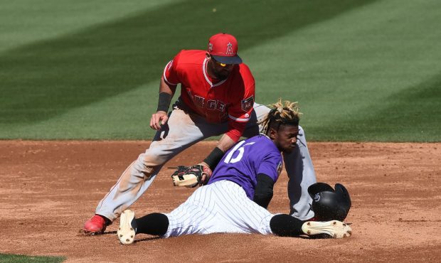 SCOTTSDALE, AZ - FEBRUARY 27:  Raimel Tapia #15 of the Colorado Rockies is tagged out while attempt...
