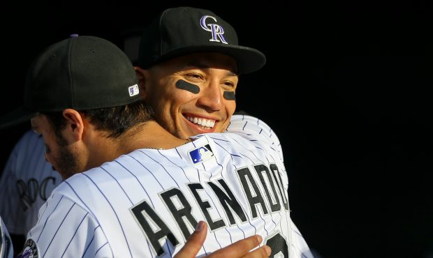 Carlos Gonzalez #5 of the Colorado Rockies hugs Nolan Arenado #28 after the final game of the seaso...