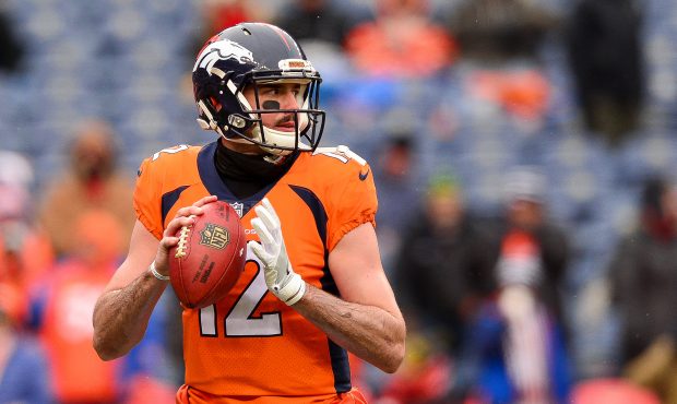 Paxton Lynch #12 of the Denver Broncos throws as he warms up before a game against the Kansas City ...