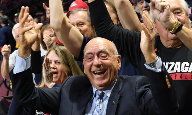 Dick Vitale poses with Gonzaga Bulldogs fans before the team's semifinal game of the West Coast Con...