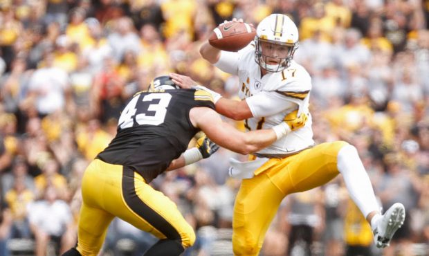 IOWA CITY, IOWA- SEPTEMBER 2:  Quarterback Josh Allen #17 of the Wyoming Cowboys escapes a tackle f...