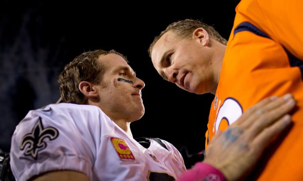 DENVER, CO - OCTOBER 28:  Quarterback Drew Brees #9 of the New Orleans Saints congratulates Quarter...
