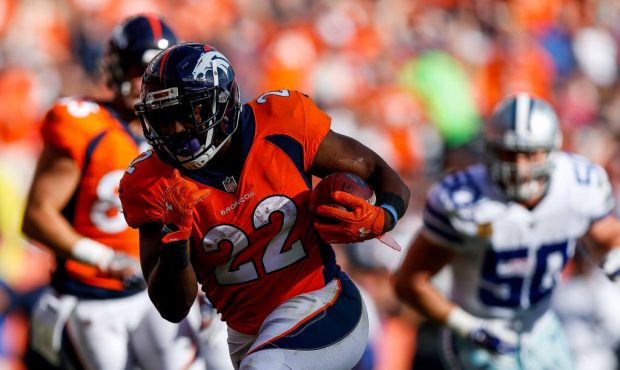DENVER, CO - SEPTEMBER 17:  Running back C.J. Anderson #22 of the Denver Broncos rushes after a cat...