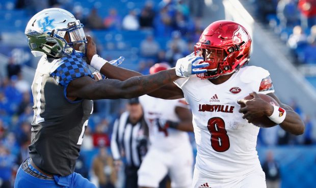 LEXINGTON, KY - NOVEMBER 25:  Lamar Jackson #8 of the Louisville Cardinals runs with the ball while...