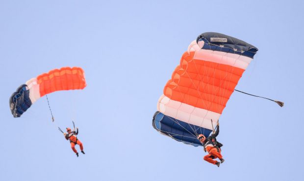DENVER, CO - AUGUST 31: Skydivers descend toward the field during the pre-game show before a presea...