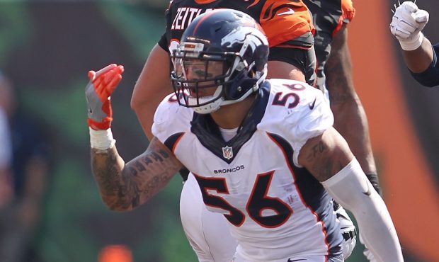 Shane Ray #56 of the Denver Broncos celebrates after tackling Andy Dalton #14 of the Cincinnati Ben...