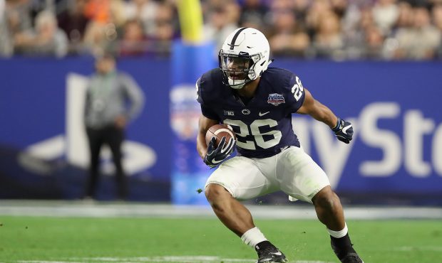 Saquon Barkley #26 of the Penn State Nittany Lions rushes the football against the Washington Huski...